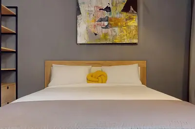 Un ou plusieurs lits dans un hébergement de l'établissement Loft Unique au Design Contemporain