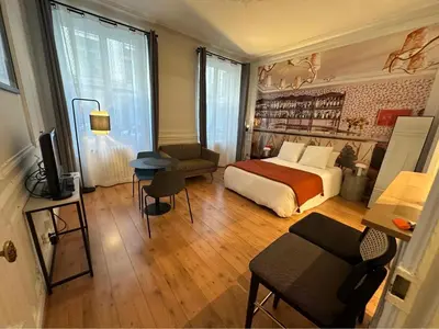 Un ou plusieurs lits dans un hébergement de l'établissement appartement Paris 8