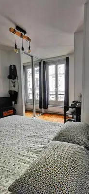Un ou plusieurs lits dans un hébergement de l'établissement Lovely flat Abbesses center - Paris Montmartre