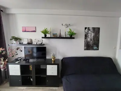 Coin salon dans l'établissement Apartment Louvre