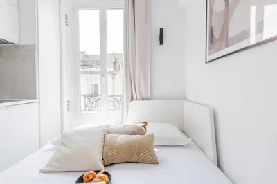 Un ou plusieurs lits dans un hébergement de l'établissement Cozy studio for 2 people - Place de la République