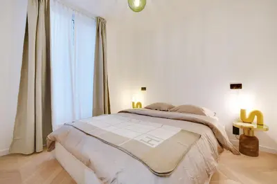 Un ou plusieurs lits dans un hébergement de l'établissement Appartement de luxe à Boulogne