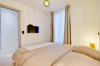 Un ou plusieurs lits dans un hébergement de l'établissement Appartement de luxe à Boulogne