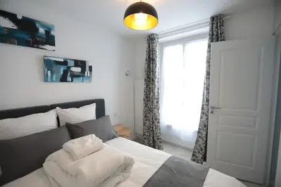 Un ou plusieurs lits dans un hébergement de l'établissement Appartement élégant - Montmartre