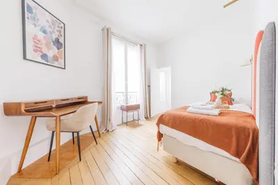 Un ou plusieurs lits dans un hébergement de l'établissement Exceptional apartment near the Eiffel Tower 3 BDR 5 P