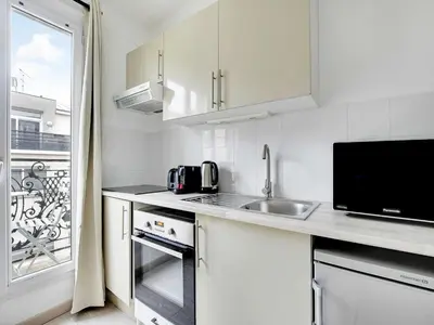 Cuisine ou kitchenette dans l'établissement Charming flat - 1BDR 2P Rue Saint Maur