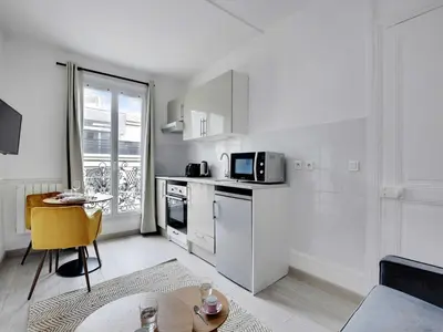 Cuisine ou kitchenette dans l'établissement Charming flat - 1BDR 2P Rue Saint Maur