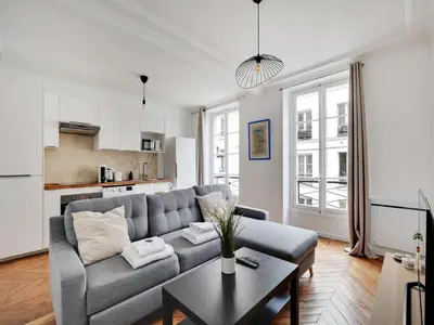Coin salon dans l'établissement Charming flat near Grands Boulevards
