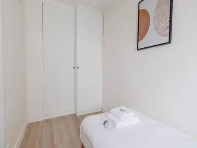 Un ou plusieurs lits dans un hébergement de l'établissement Appart proche Quai de Seine - 2BDR 3P 16ème Arr