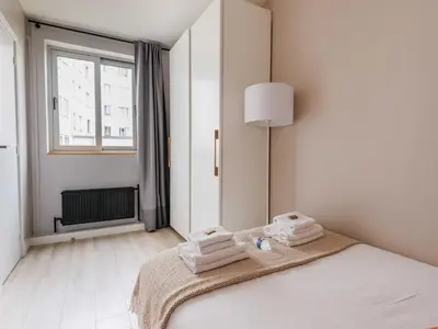 Un ou plusieurs lits dans un hébergement de l'établissement Appart proche Quai de Seine - 2BDR 3P 16ème Arr