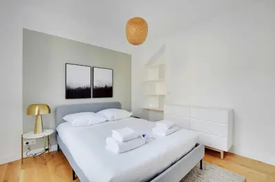 Un ou plusieurs lits dans un hébergement de l'établissement Modern flat 2P in the heart of MARAIS
