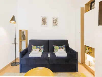 Coin salon dans l'établissement Charming studio in the Marais - Mobility lease