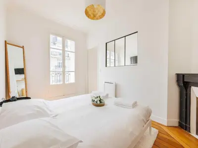 Un ou plusieurs lits dans un hébergement de l'établissement Flat with balcony 1BDR 2P - Batignolles