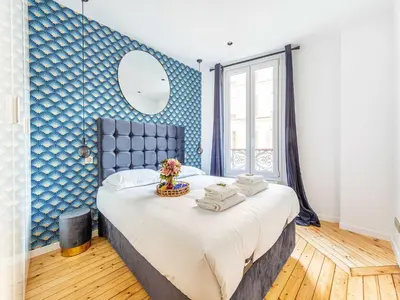 Un ou plusieurs lits dans un hébergement de l'établissement Charming flat -1BDR 2P- Batignolles