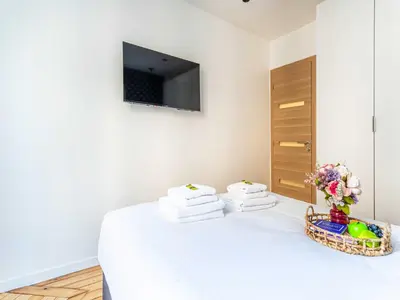 Télévision ou salle de divertissement dans l'établissement Charming flat -1BDR 2P- Batignolles
