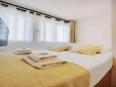 Un ou plusieurs lits dans un hébergement de l'établissement Cosy studio 2P- TROCADERO EIFFEL TOWER