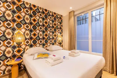 Un ou plusieurs lits dans un hébergement de l'établissement Magnifique apartment 2BR 6P Gare du Nord