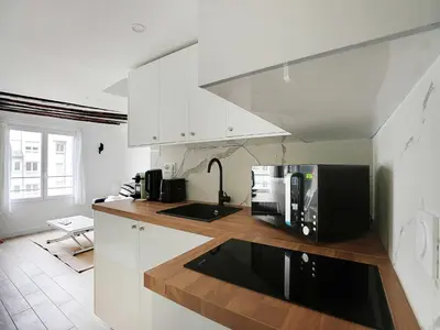 Cuisine ou kitchenette dans l'établissement Charming studio near les Halles - Mobility lease