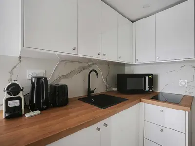 Cuisine ou kitchenette dans l'établissement Charming studio near les Halles - Mobility lease