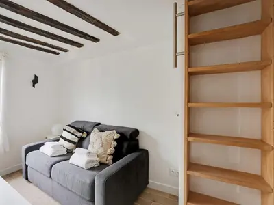 Coin salon dans l'établissement Charming studio near les Halles - Mobility lease
