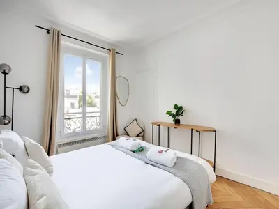 Un ou plusieurs lits dans un hébergement de l'établissement Very nice appt 1 BDR 2P- VOLTAIRE CHARONNE