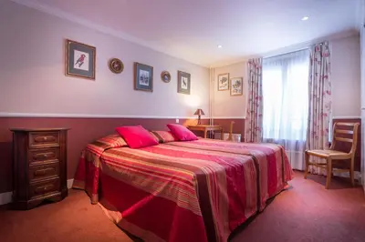 Un ou plusieurs lits dans un hébergement de l'établissement Hotel des Arts - Cite Bergere