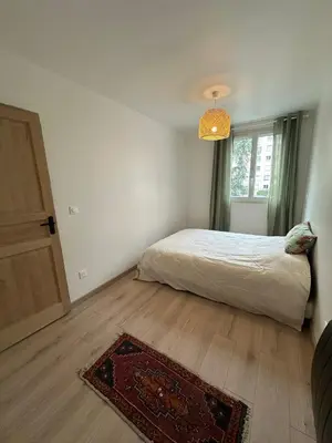 Un ou plusieurs lits dans un hébergement de l'établissement Apartment - 2 rooms - Malakoff