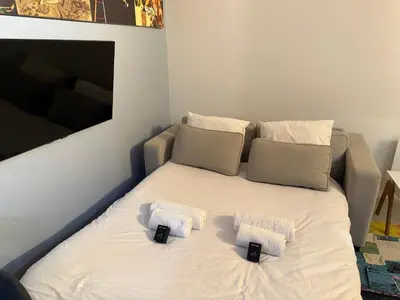 Un ou plusieurs lits dans un hébergement de l'établissement Studio moderne proche Parc des Expos et Metro L12