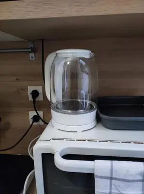 Cuisine ou kitchenette dans l'établissement Jardin mini maison