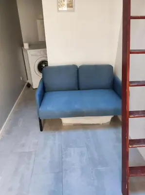 Coin salon dans l'établissement Jardin mini maison