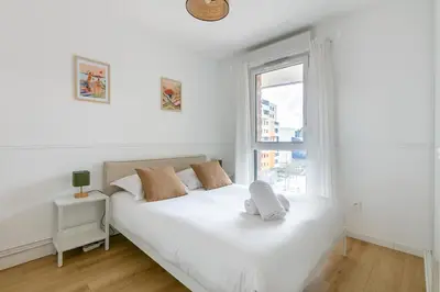 Un ou plusieurs lits dans un hébergement de l'établissement Le Duplex des Docks by So Homy - 2 Bed Room - 4 PAX