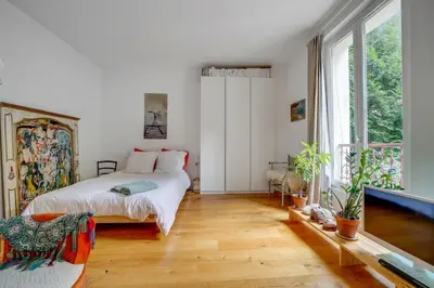 Un ou plusieurs lits dans un hébergement de l'établissement Appartement Romantique à Saint-Ouen