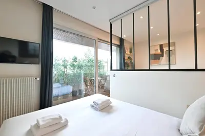 Un ou plusieurs lits dans un hébergement de l'établissement Charming apartment Neuilly-sur-seine