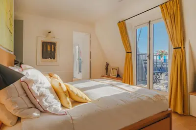 Un ou plusieurs lits dans un hébergement de l'établissement Paris St Germain Loft residence