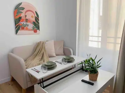 Coin salon dans l'établissement Cosy Apt with Paris Marais