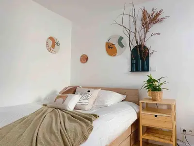 Un ou plusieurs lits dans un hébergement de l'établissement Cosy Apt with Paris Marais
