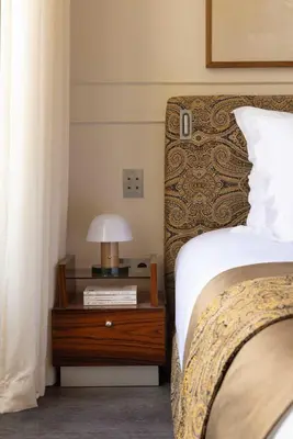 Un ou plusieurs lits dans un hébergement de l'établissement Hotel Palais Bourbon