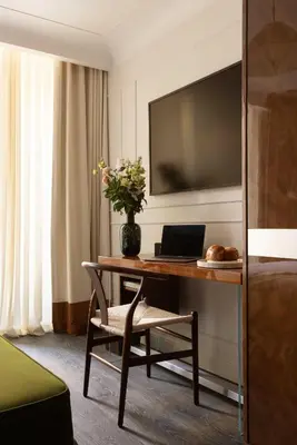 Télévision ou salle de divertissement dans l'établissement Hotel Palais Bourbon