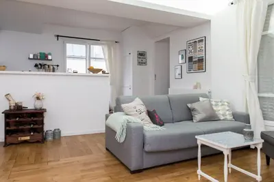 Coin salon dans l'établissement Beautiful Apt in Heart of Paris 2nd
