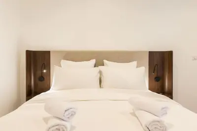 Un ou plusieurs lits dans un hébergement de l'établissement Elégant appartement à deux pas du Moulin Rouge