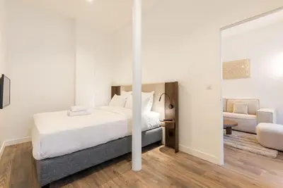 Un ou plusieurs lits dans un hébergement de l'établissement Elégant appartement à deux pas du Moulin Rouge