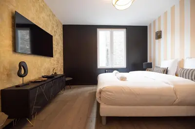 Un ou plusieurs lits dans un hébergement de l'établissement CIA - Triplex in Paris 17th