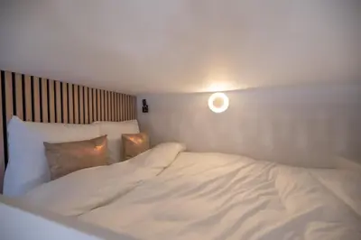 Un ou plusieurs lits dans un hébergement de l'établissement CIA - Mezzanine Studio by Arc de Triomphe