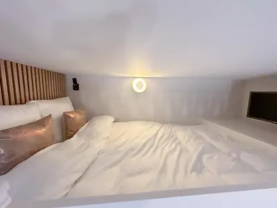 Un ou plusieurs lits dans un hébergement de l'établissement CIA - Mezzanine Studio by Arc de Triomphe