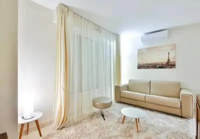 Coin salon dans l'établissement L'appartement Thibaud