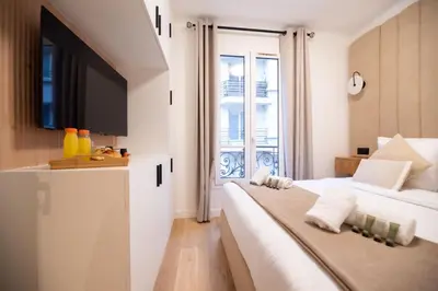 Un ou plusieurs lits dans un hébergement de l'établissement CIA - Rue de l'Étoile Haven, 4P