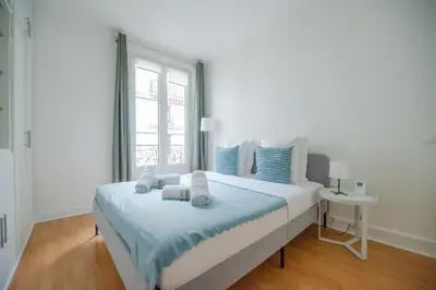 Un ou plusieurs lits dans un hébergement de l'établissement CIA - Trocadéro, cosy & cute flat