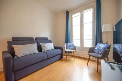 Coin salon dans l'établissement CIA - Trocadéro, cosy & cute flat