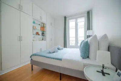 Un ou plusieurs lits dans un hébergement de l'établissement CIA - Trocadéro, cosy & cute flat