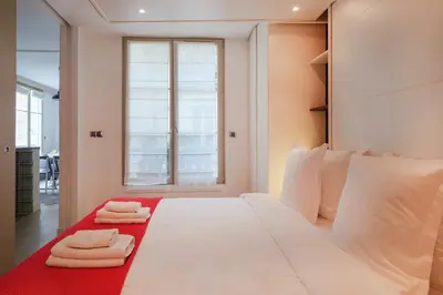 Un ou plusieurs lits dans un hébergement de l'établissement Paris Marais Bouquet Residence